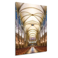 a grand cathedral with a high vaulted ceiling, ornate architectural details, and rows of wooden pews leading to the altar.