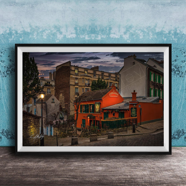 a charming street scene in a European city, with colorful buildings, a red building with a green awning, and a lamppost in the foreground.