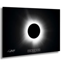a total solar eclipse, with the sun appearing as a bright white circle against a black background.