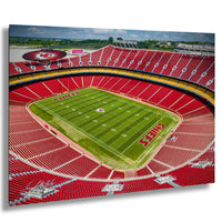 a large football stadium with a green field and red seating.