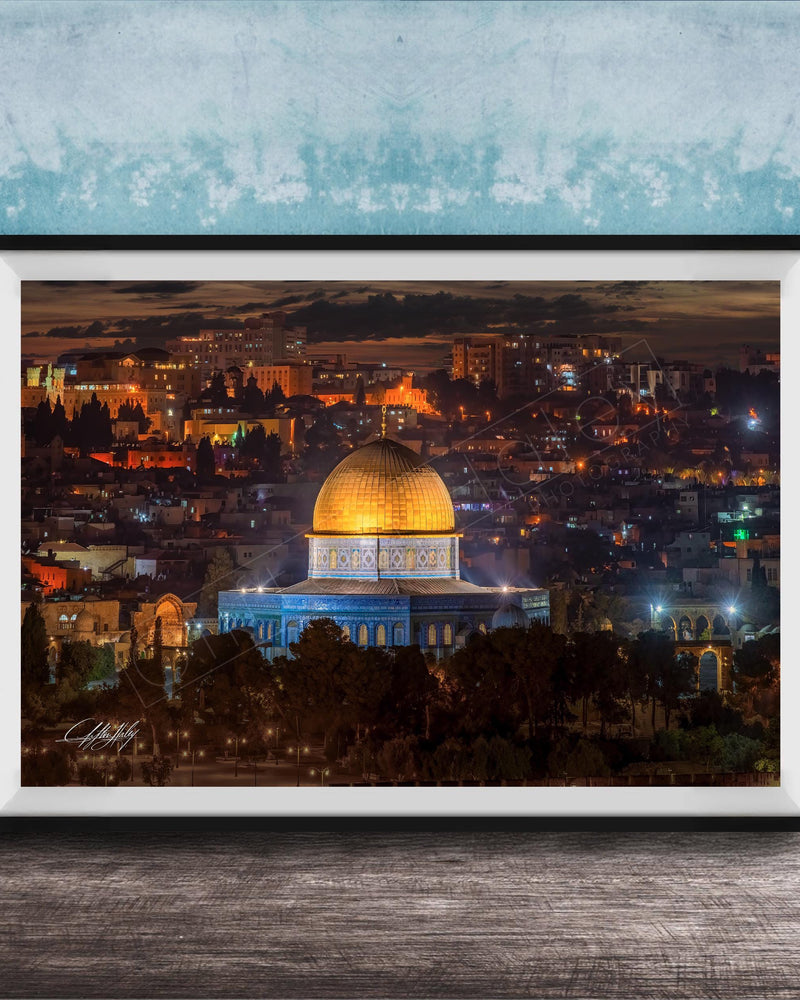 a cityscape at night, with a large dome-shaped building illuminated in the center. The city is filled with numerous buildings and structures, creating a vibrant and bustling urban atmosphere.