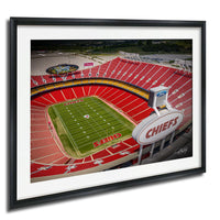 The image is an aerial view of a football stadium with a large "CHIEFS" sign, surrounded by a large field and seating areas.