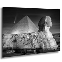 the Great Pyramid of Giza and the Sphinx, with a starry night sky in the background.
