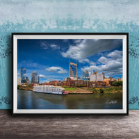 A framed photograph of the Nashville skyline, featuring the iconic skyline of Nashville, Tennessee, with the city's iconic landmarks such as the Tennessee State Capitol and the Nashville River.