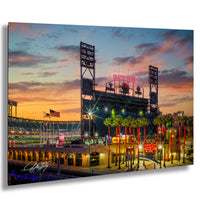 A vibrant and colorful night scene at Oracle Park, with the stadium lights illuminating the field and surrounding area.