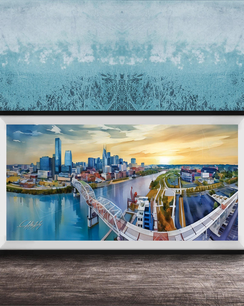 A framed painting depicting a cityscape with a bridge, buildings, and a river, set against a blue sky with a sunset.