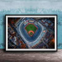 The image is an aerial view of a baseball stadium, specifically the New York Yankees stadium, with the field and surrounding buildings visible.
