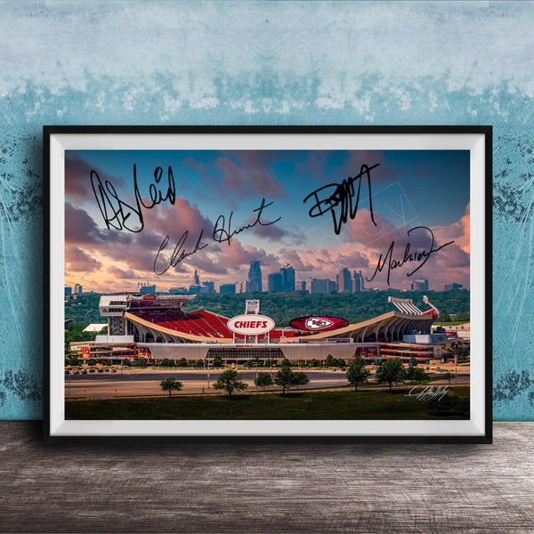 A framed photograph of a football stadium with the word "CHIEF" prominently displayed, along with the signatures of several people.