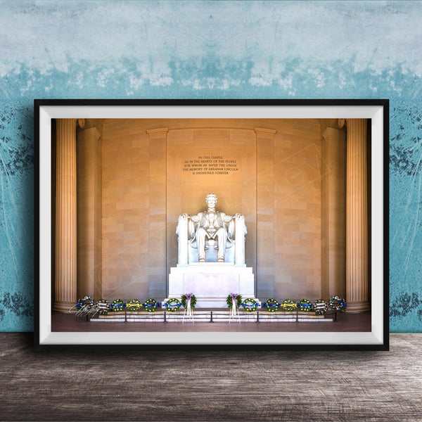 This fine art photograph captures the Lincoln Memorial in Washington DC during the quiet beauty of sunrise. The iconic marble statue of Abraham Lincoln sits beneath the powerful inscription honoring the president who preserved the Union. With soft morning light illuminating the historic monument and ceremonial wreaths placed along the base, this image celebrates one of America’s most meaningful landmarks. Perfect for collectors of Washington DC photography, presidential history artwork