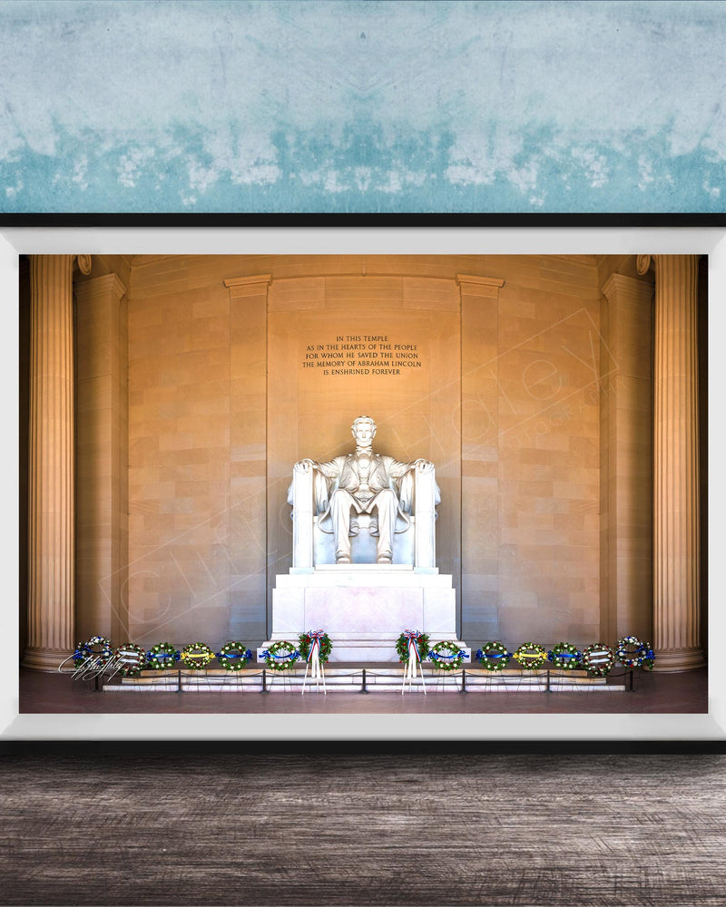 This fine art photograph captures the Lincoln Memorial in Washington DC during the quiet beauty of sunrise. The iconic marble statue of Abraham Lincoln sits beneath the powerful inscription honoring the president who preserved the Union. With soft morning light illuminating the historic monument and ceremonial wreaths placed along the base, this image celebrates one of America’s most meaningful landmarks. Perfect for collectors of Washington DC photography, presidential history artwork