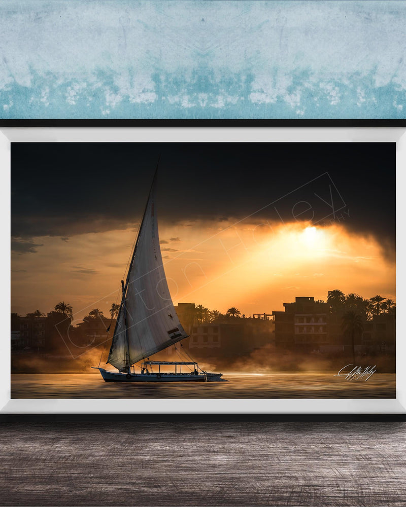 felucca sailboat art, nile river sunset print, luxor egypt fine art, egypt river photography, luxury travel wall art, serene river landscape, egyptian culture artwork, nile boat photography, sunset fine art print, timeless travel decor, historic river wall art, luxury collector photography, egypt fine art print, calming interior artwork