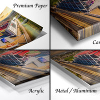 The image is a collage of four different views of a large stadium, with each view presented in a different medium: a printed paper, a canvas wrap, an acrylic print, and a metal/aluminum print.