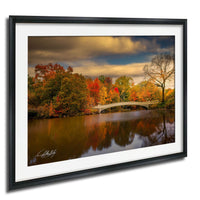 a serene autumn landscape with a calm river reflecting the vibrant colors of the trees lining its banks.