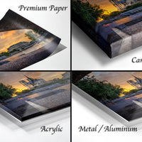 The image is a collage of four photos depicting a sunset over a cityscape, with the text "Premium Paper", "Canvas Wrap", "Acrylic", and "Metal/Aluminum" indicating the materials used for the prints.