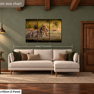 The image is a living room with a large, white sectional sofa and a wooden coffee table. Above the sofa, there is a large painting depicting a lion in a grassy field. The painting is framed by a wooden border and is mounted on a green wall. The room also features a wooden door and a wooden ceiling with exposed beams.