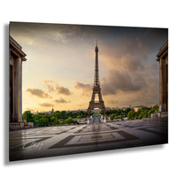 the Eiffel Tower, a famous landmark in Paris, France, with a dramatic sky in the background.