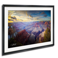 The image is a framed photograph of the Grand Canyon, showcasing the vast and breathtaking landscape with its dramatic rock formations and vibrant colors.