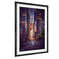 a cityscape with tall buildings, a bridge, and a street with cars and pedestrians.