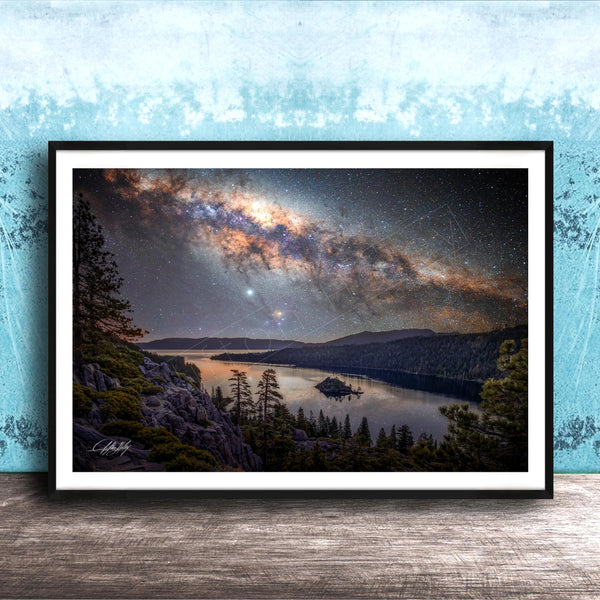 The image is a framed photograph depicting a serene night scene with a lake, mountains, and a starry sky.