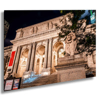 a grand, classical-style building with columns and a statue of a lion, illuminated at night.