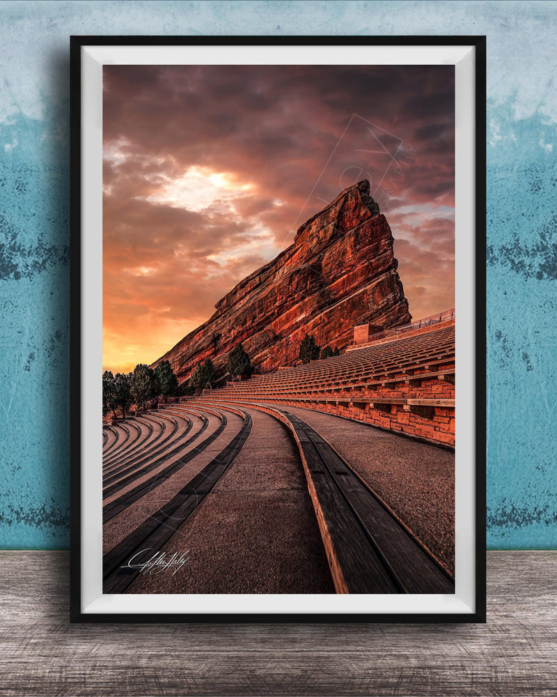a large, steep rock formation with a dramatic sky in the background, creating a striking and visually appealing scene.