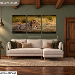 The image is a livingroom size chart that provides dimensions for a large wall art piece depicting a lion in a grassy field.