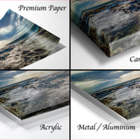 four different views of a landscape photograph, including a close-up of the ocean, a close-up of a rocky shore, and a close-up of a sandy beach. The text labels the different views as "Premium Paper", "Canvas Wrap", "Acrylic", and "Metal/Aluminum".