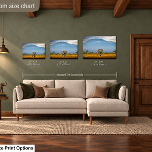 a living room with a large sofa, a wooden door, and a painting of elephants in the background. The sofa is positioned in front of a wall with a living room size chart indicating the dimensions of the sofa in relation to the paintings.