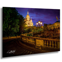 a serene night scene featuring a large, illuminated cathedral in the background, with a carousel visible in the foreground.