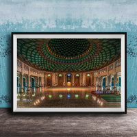 a grand, ornate mosque with a large, domed ceiling and intricate tile work. The interior features a central courtyard surrounded by arched doorways and windows, creating a sense of spaciousness and elegance.