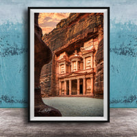 A framed photograph of the ancient ruins of Petra, a famous archaeological site in Jordan, featuring the iconic Treasury of the Kings carved into the rock face.