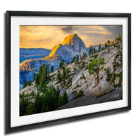 a breathtaking mountain landscape with a large, majestic peak in the distance, surrounded by a lush forest and a dramatic sky with vibrant colors.