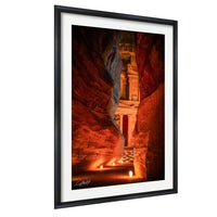a cave with a carved stone structure, illuminated by warm lighting that creates a cozy and inviting atmosphere.