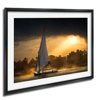 felucca sailboat art, nile river sunset print, luxor egypt fine art, egypt river photography, luxury travel wall art, serene river landscape, egyptian culture artwork, nile boat photography, sunset fine art print, timeless travel decor, historic river wall art, luxury collector photography, egypt fine art print, calming interior artwork