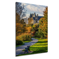 A picturesque scene of a castle surrounded by a lush, colorful garden with a winding path leading up to it.
