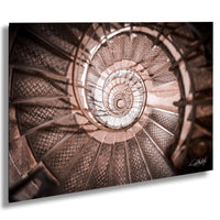 a spiral staircase with intricate patterns and designs, creating a visually captivating and mesmerizing effect.