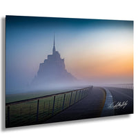 a foggy landscape with a tall, spire-topped building in the distance, creating a serene and atmospheric scene.