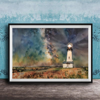 A framed watercolor painting depicting a lighthouse on a grassy field, with a starry sky in the background.