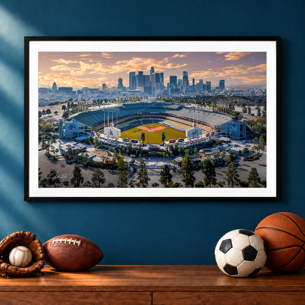 A framed photograph of a baseball stadium in Los Angeles, California, with the city skyline in the background.
