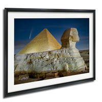 the Great Pyramid of Giza and the Sphinx in Egypt, with the pyramids illuminated against a starry night sky.