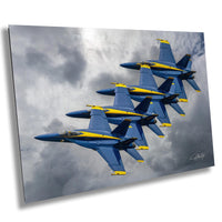 a group of fighter jets flying through a cloudy sky