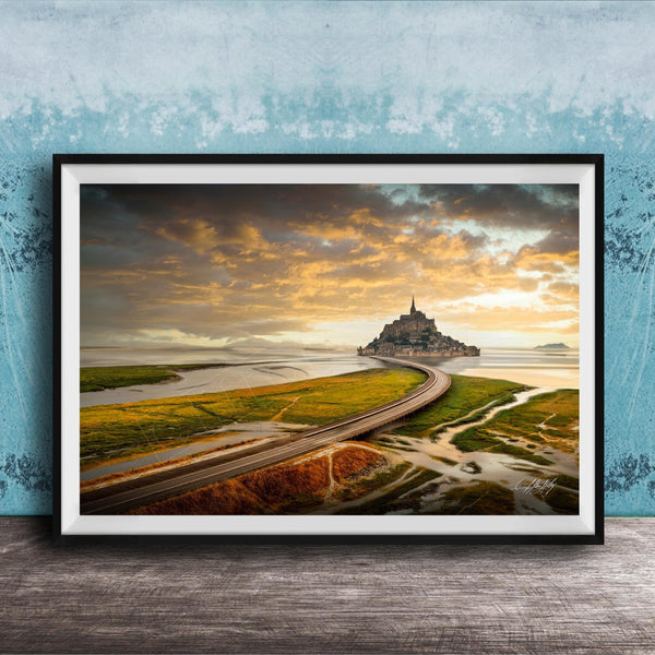a picturesque landscape with a winding road leading to a castle on a grassy island, set against a dramatic sky with clouds and a warm, golden glow.