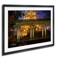 a nighttime view of the Eiffel Tower in Paris, France, with its intricate iron lattice structure illuminated against the dark sky.