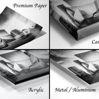 The image is a collage of four different photographs, each depicting a cityscape. The photographs are labeled as "Premium Paper", "Canvas Wrap", "Acrylic", and "Metal/Aluminum".