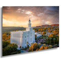 a large white temple with a tall tower, surrounded by trees and mountains, with a colorful sunset sky in the background.