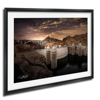 a large dam with a bridge spanning across it, set against a dramatic sky with clouds.