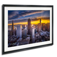 a cityscape with tall buildings and skyscrapers at sunset, creating a vibrant and colorful skyline.