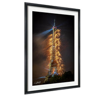 a tall tower with a bright light at the top, surrounded by a shower of sparks or firework-like effects, creating a visually striking and dynamic scene.