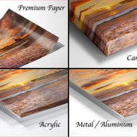 The image is a collage of four different views of a sunset over a beach, with each view represented by a different material: premium paper, canvas wrap, acrylic, and metal/aluminum.