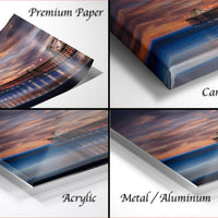 The image is a collage of four different images, each depicting a sunset over a body of water. The images are labeled as "Premium Paper", "Canvas Wrap", "Acrylic", and "Metal/Aluminum".